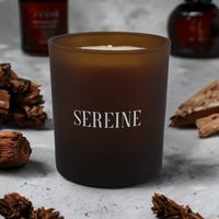 Ambience luxury candle surrounded by ingredients